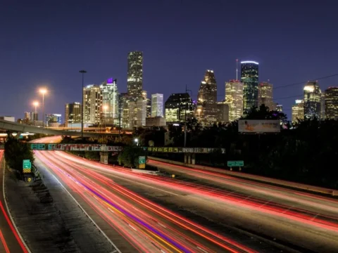 time lapse photography of vehicle traveling with a speed of light in road