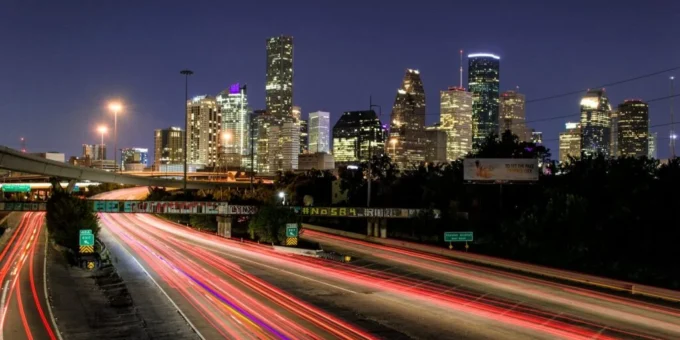 time lapse photography of vehicle traveling with a speed of light in road