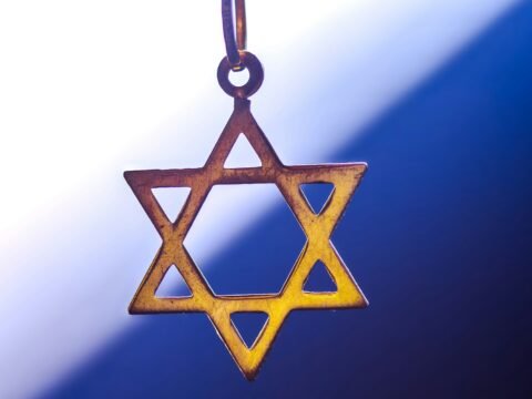 a star of david hanging from a chain