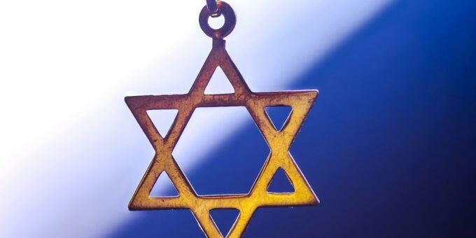 a star of david hanging from a chain